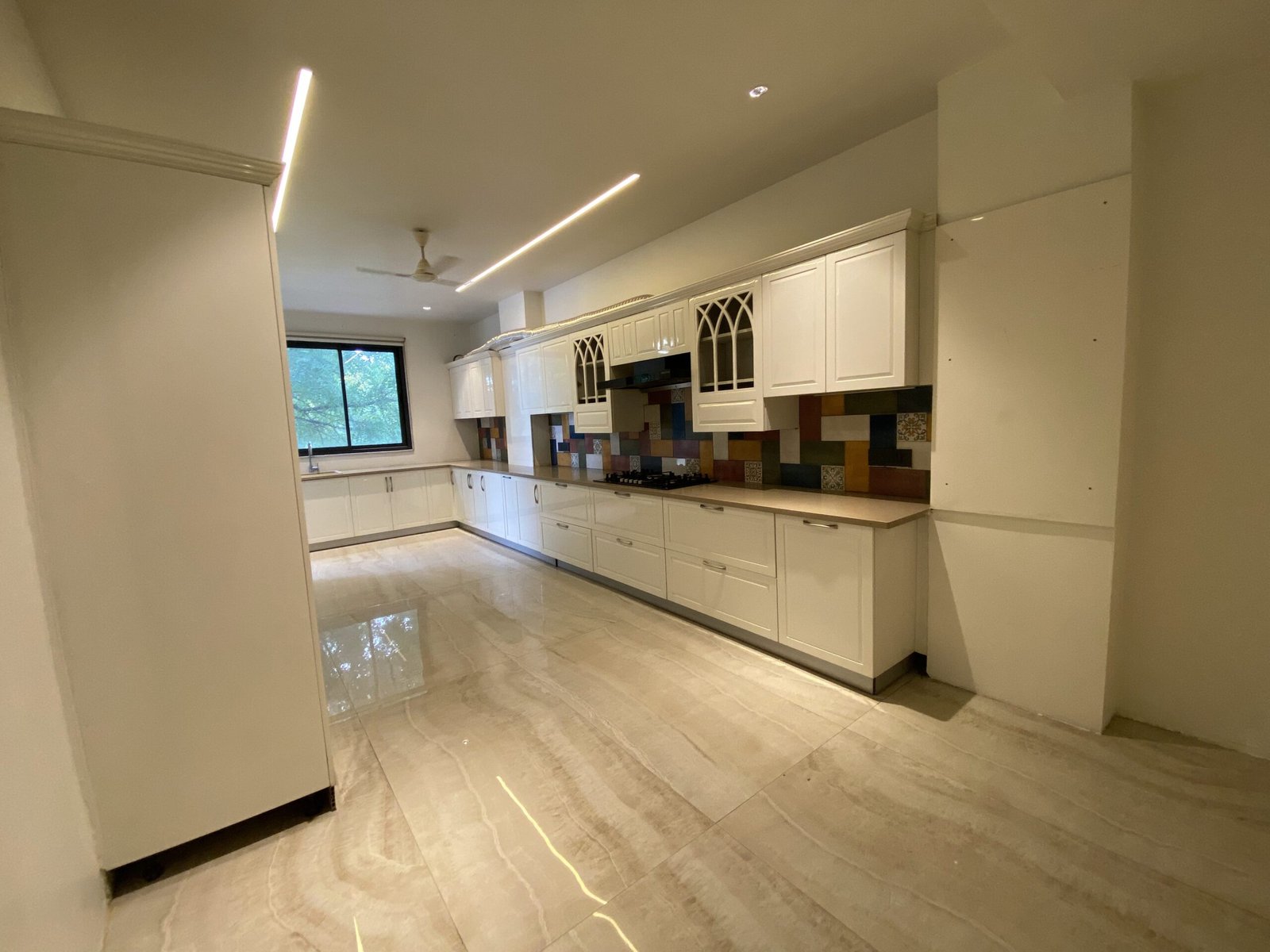 Large modular kitchen in a luxury 4 BHK builder floor at Emaar Emerald Hills Sector 65 Gurgaon
